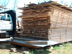Air-dried pine lumber for lap siding on a c.1920 barn.
