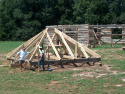 White oak timber frame hip roof cut for a log home and preassembled on our lumber yard.